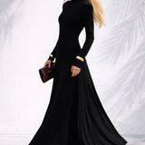 Robe longue dos nu col montant